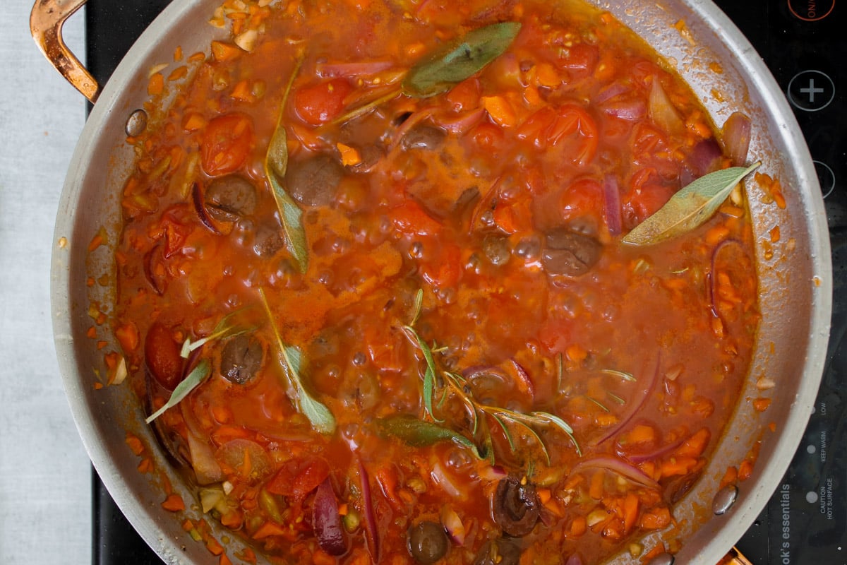 overhead image of cooking sauce in a skillet.