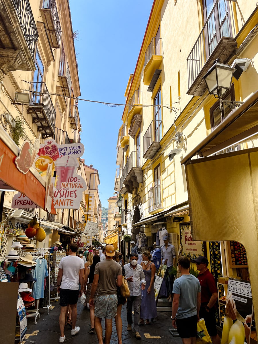 Scenic view of Sorrento coastline with cliffs and colorful buildings overlooking the Bay of Naples