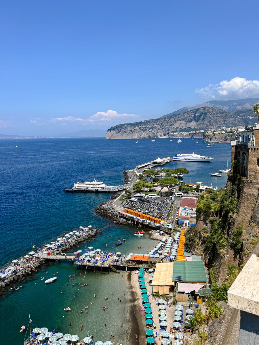 Aerial photo of Sorrento, Italy at sunset with Mount Vesuvius in the distance