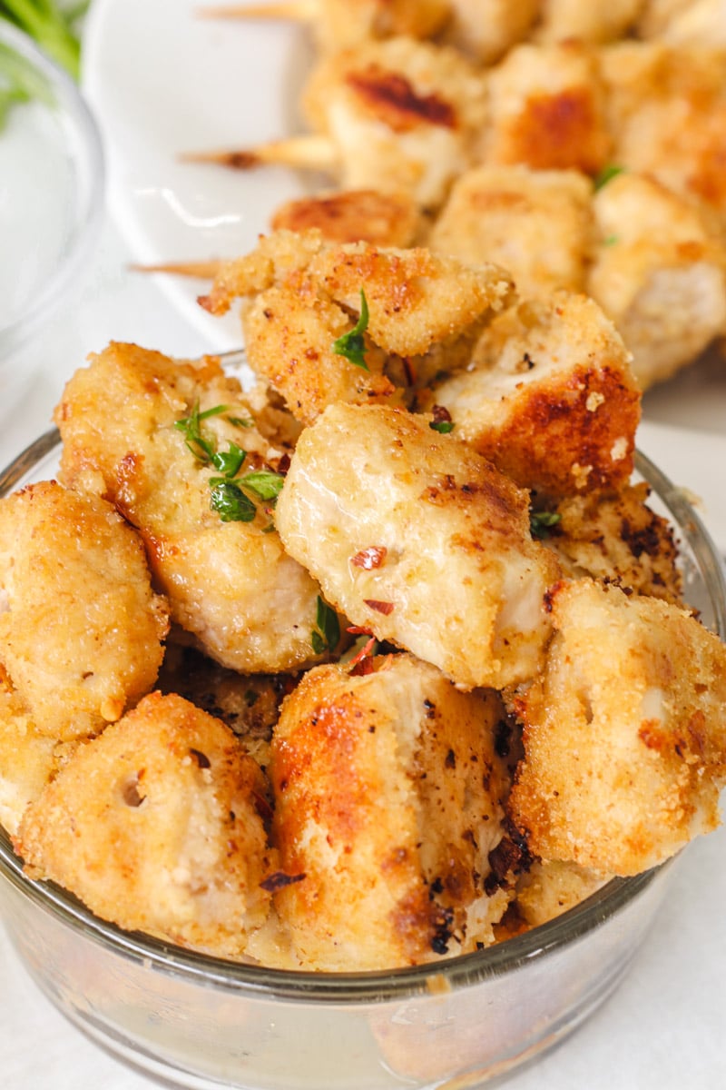 close up image of chicken spiedini pieces in a bowl.