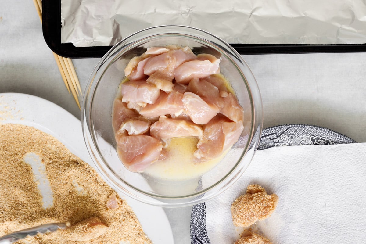 overhead image of prepping chicken for chicken skewers.