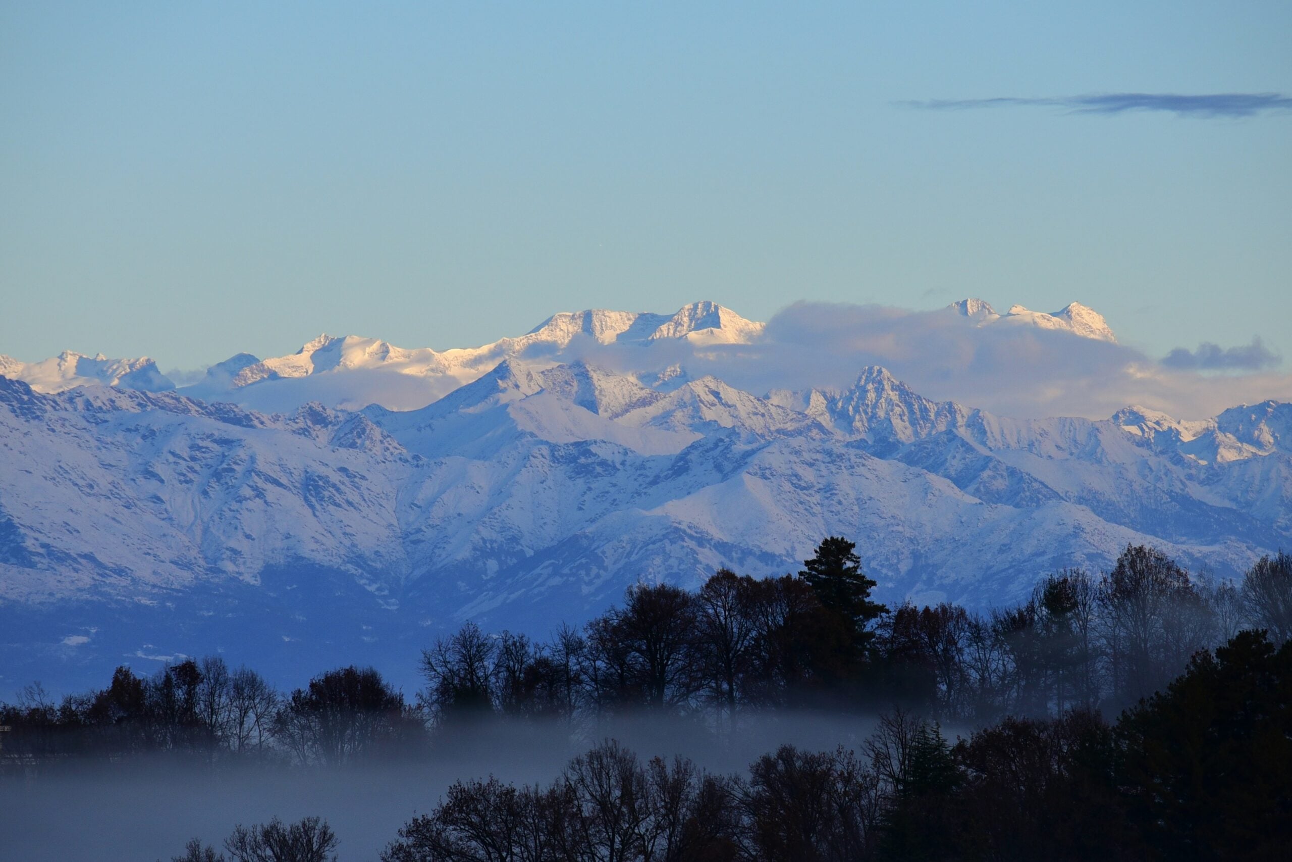 A breathtaking view of the Alps from Turin captures the majestic mountain range as it rises dramatically against the skyline. The cityscape in the foreground, with its blend of historic and modern architecture, perfectly complements the natural grandeur of the Alps. Is Turin worth visiting? Absolutely! This stunning vista highlights the unique charm of Turin, where visitors can enjoy the beauty of both urban and natural landscapes, making it an unforgettable destination.
