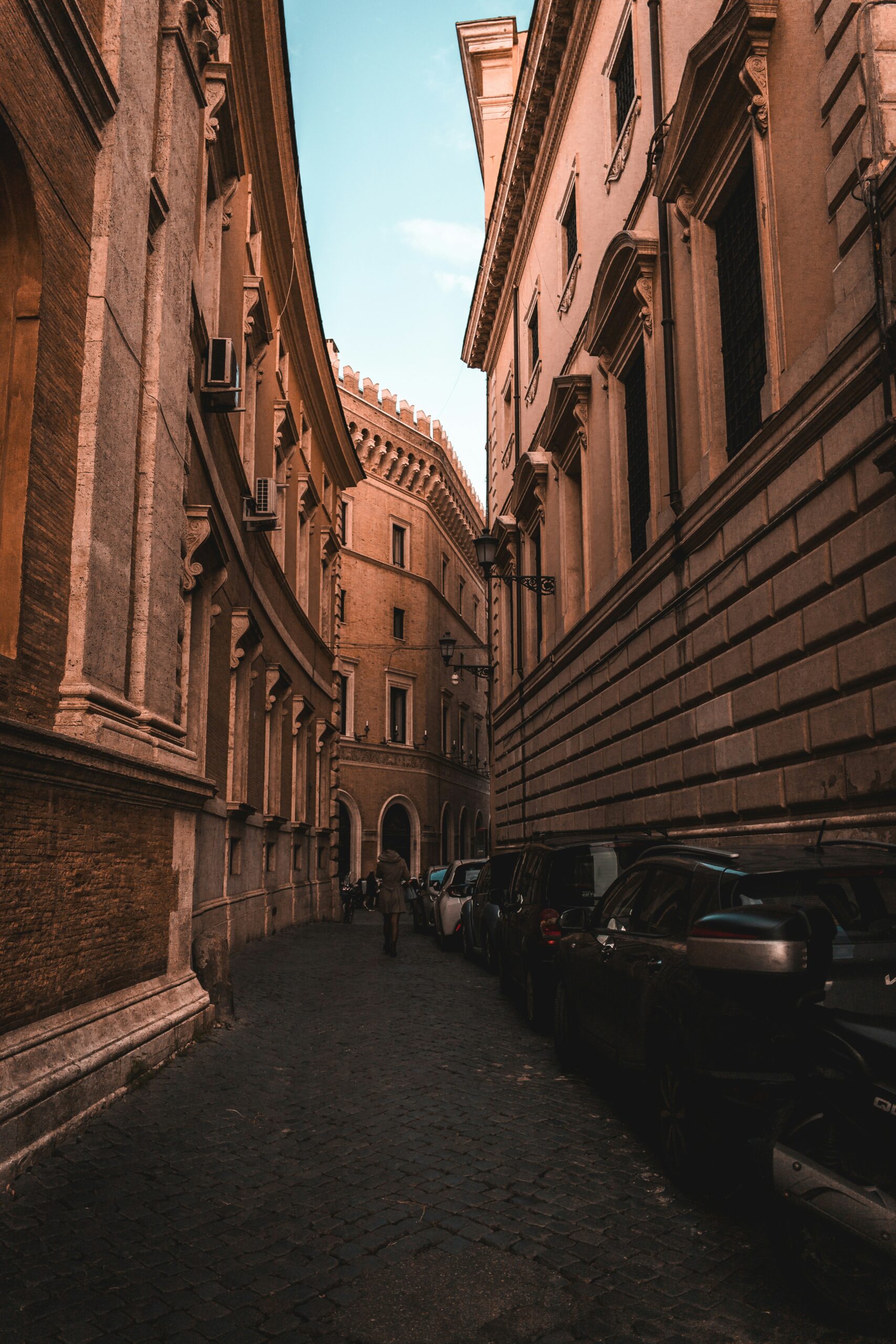 Photograph of one of the coolest streets in Rome, Italy. This dynamic image showcases a vibrant street filled with stylish boutiques, trendy cafes, and lively street art. The bustling atmosphere and modern charm make it a standout among the streets in Rome, Italy, offering a unique blend of contemporary culture and historic architecture for visitors to enjoy.