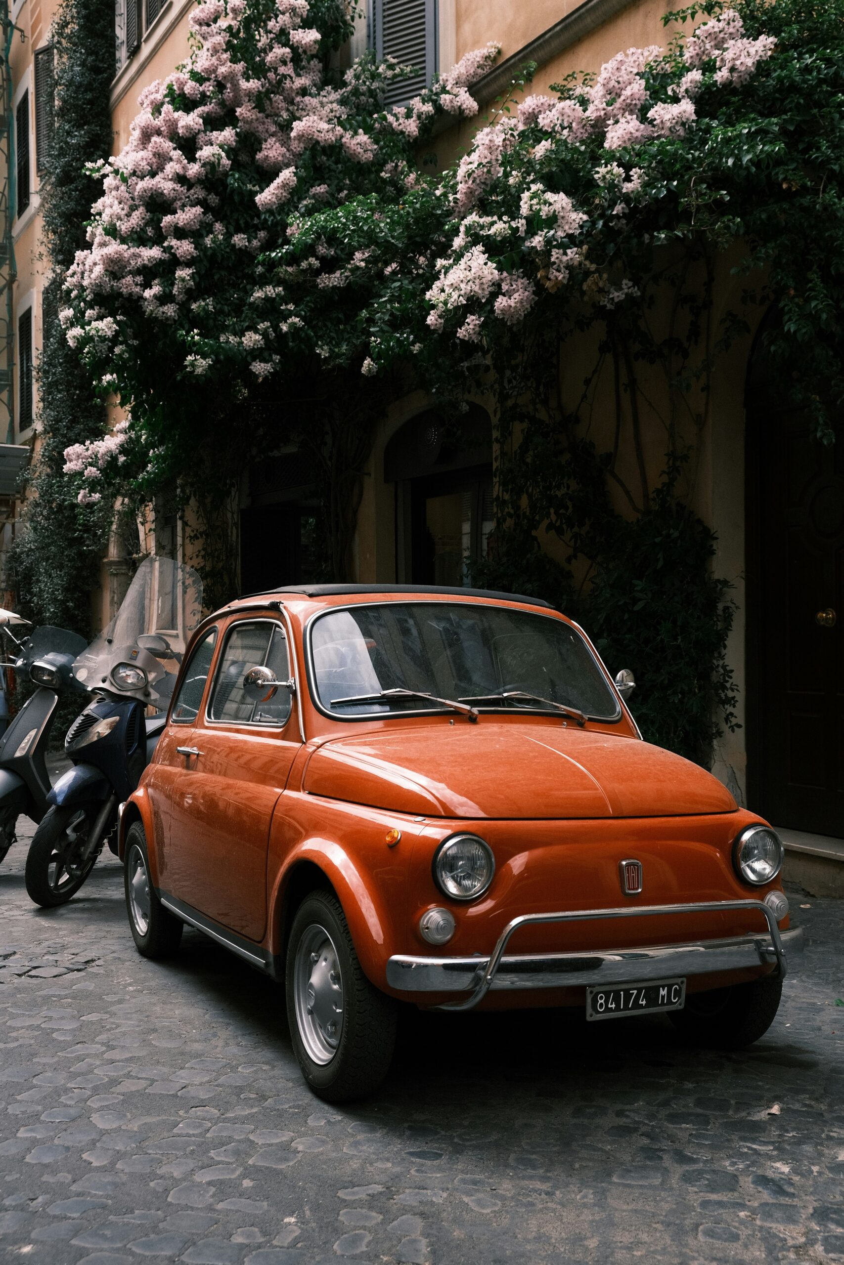 Photograph of one of the coolest streets in Rome, Italy. This lively image showcases a vibrant street filled with trendy shops, bustling cafes, and stylish pedestrians. The eclectic mix of modern and historic architecture embodies the unique charm of streets in Rome, Italy, making it a must-visit destination for travelers seeking a blend of tradition and contemporary flair.