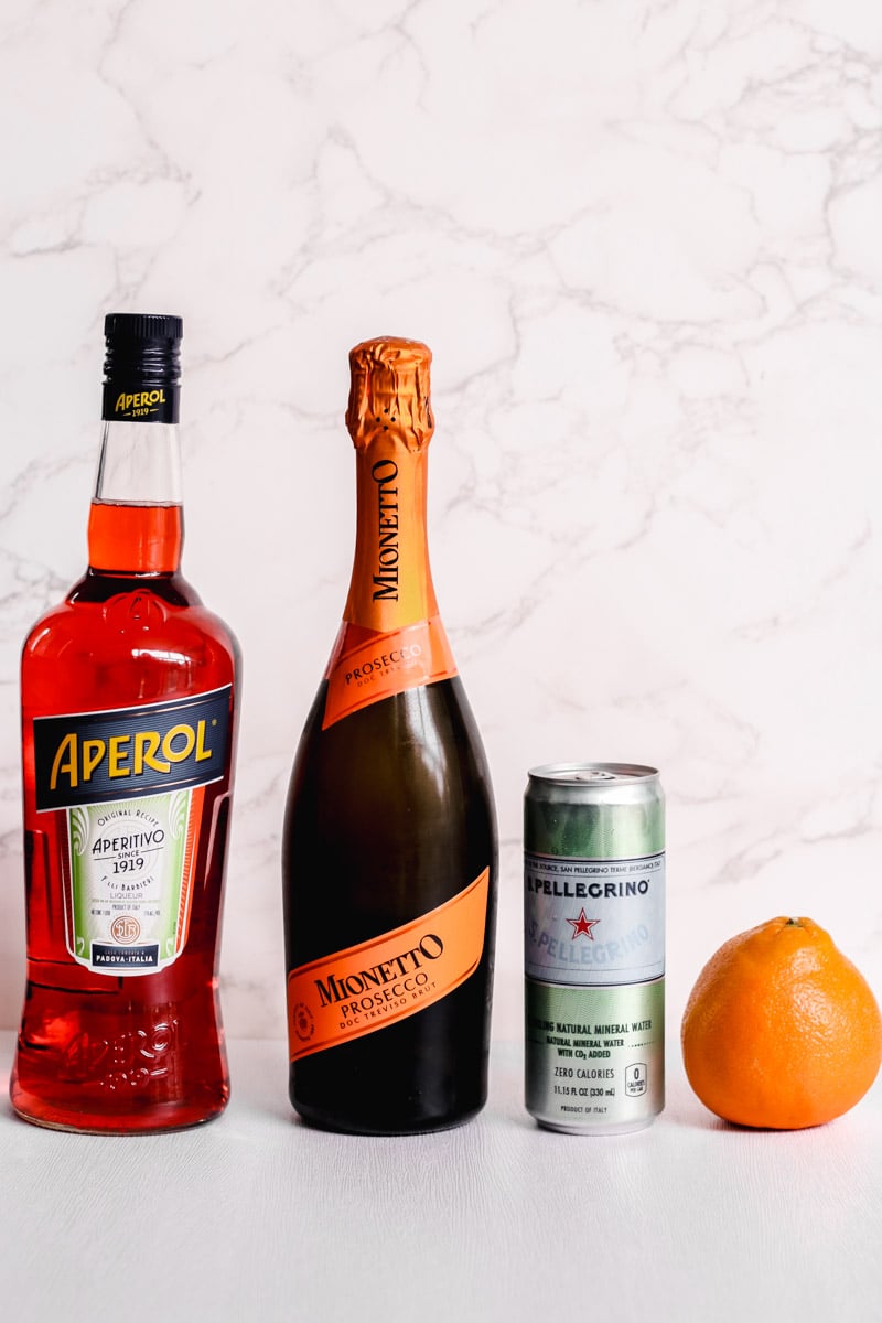 close up image of ingredients to make aperol spritz.