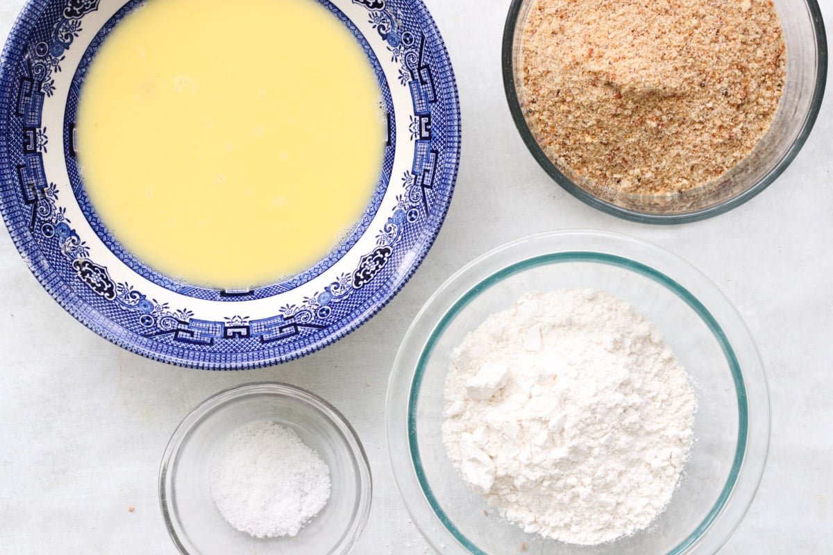overhead image of ingredients to bread eggplant for Parmigiana di Melanzane (Traditional Eggplant Parmigiana).