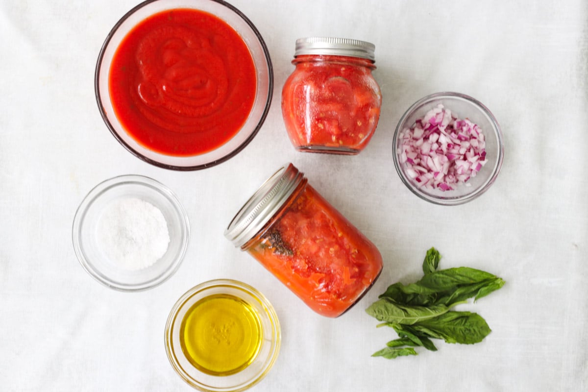 overhead image of ingredients to make a tomato sauce.