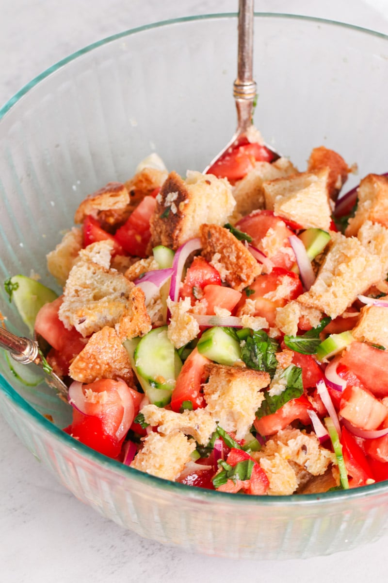 close-up image of a panzanella salad in a bowl.