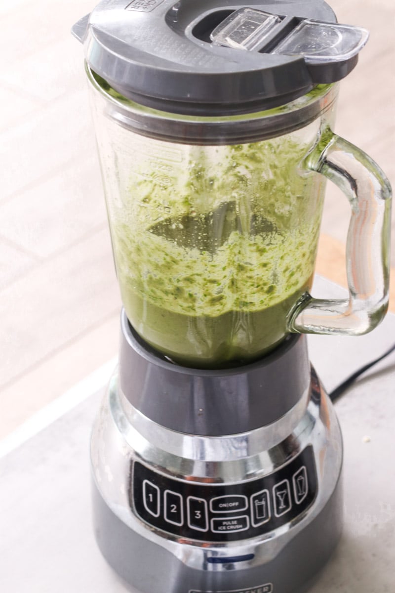 close up image of making pesto in a blender.