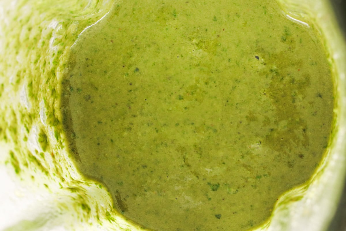 close up photo of pesto genovese in a blender.