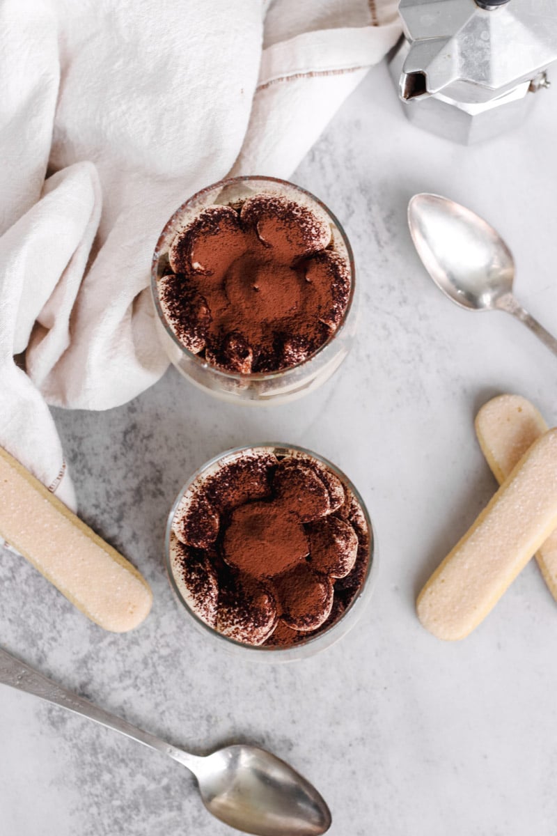 overhead image of authentic Italian tiramisu recipe in glasses.