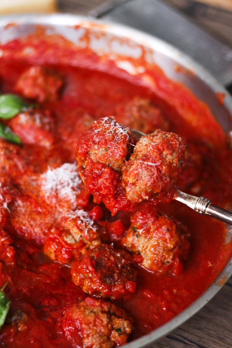 close up image of meatballs in a tomatosauce.
