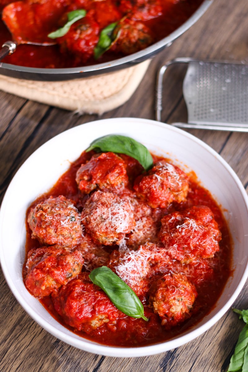 overhead image of meatballs in white bowl.