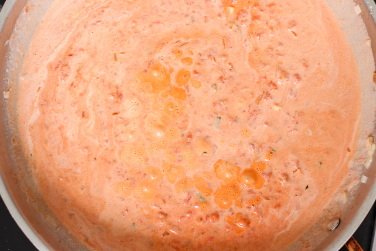 close up image of cooking sauce in a skillet.