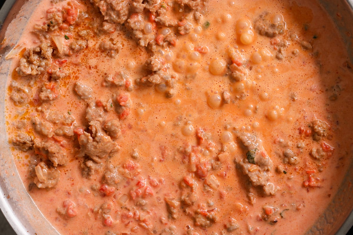 close up image of cooking sauce in a skillet.