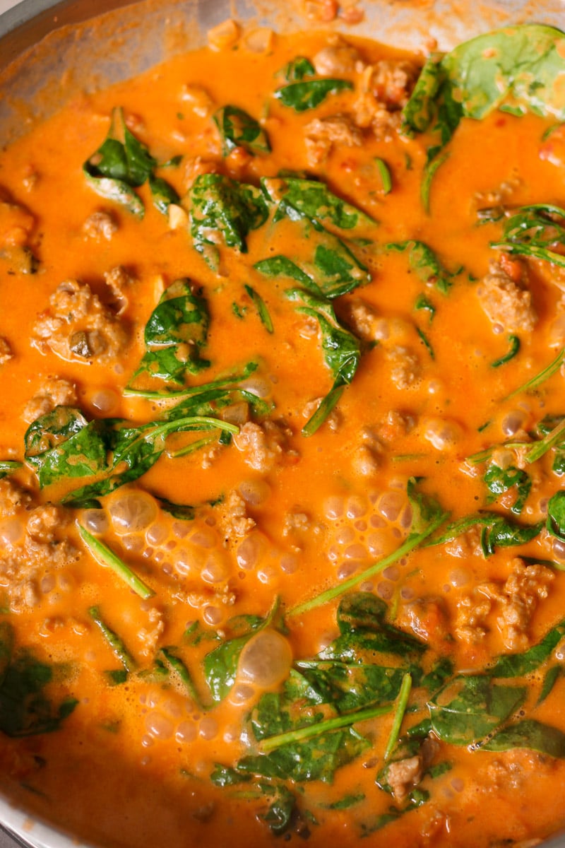 close up image of cooking sauce in a skillet.