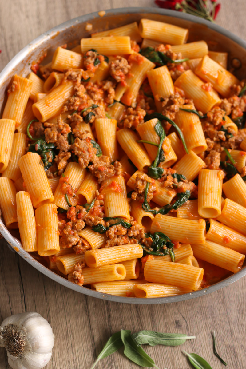 close up image of sausage rigatoni in a skillet. 