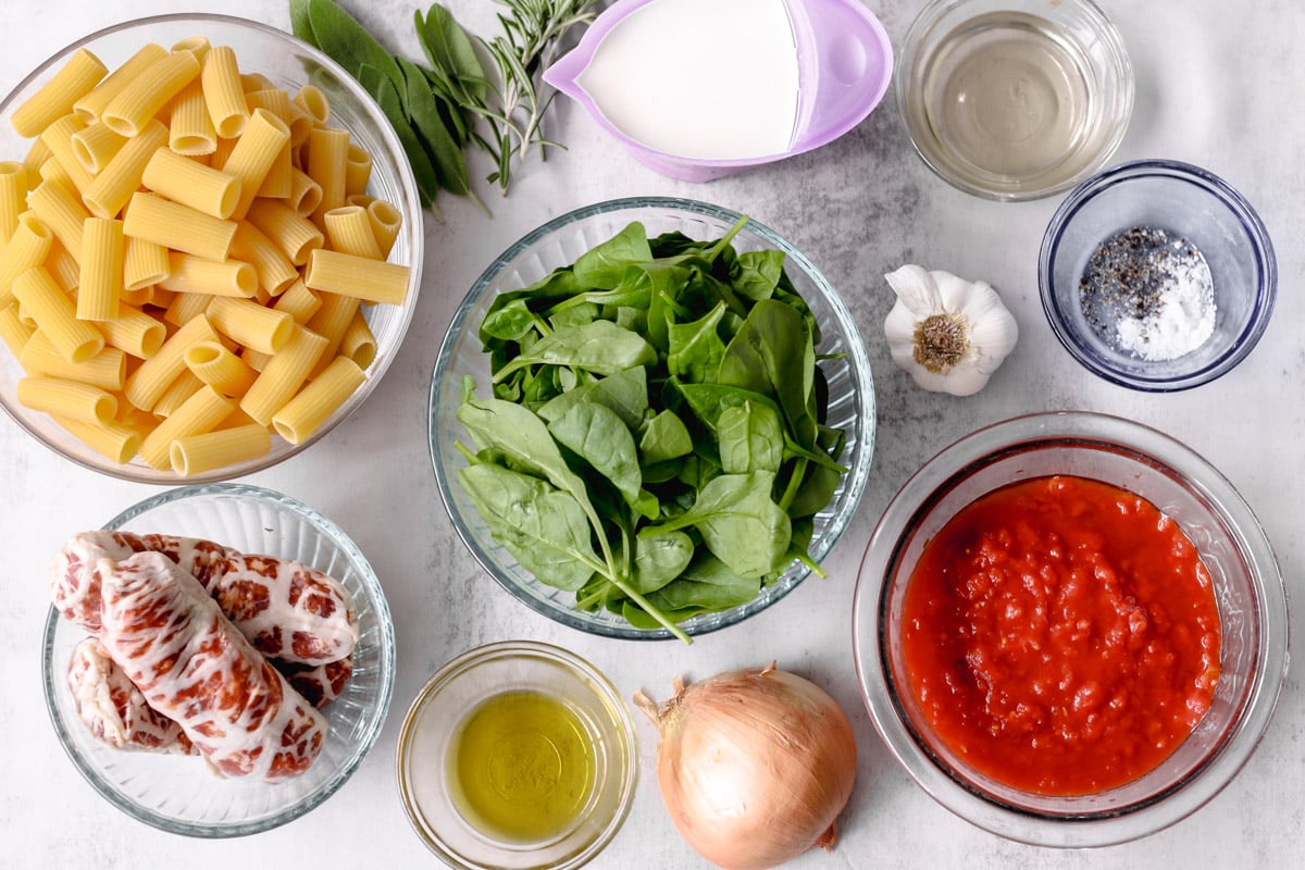 photo of ingredients in glass bowls on a white background.