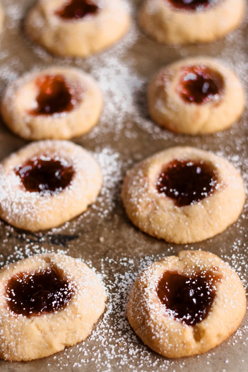 close up image of almond thumbprint cookies.
