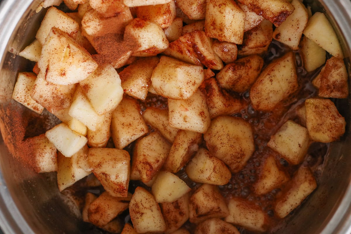 close up image cooking apple compote.