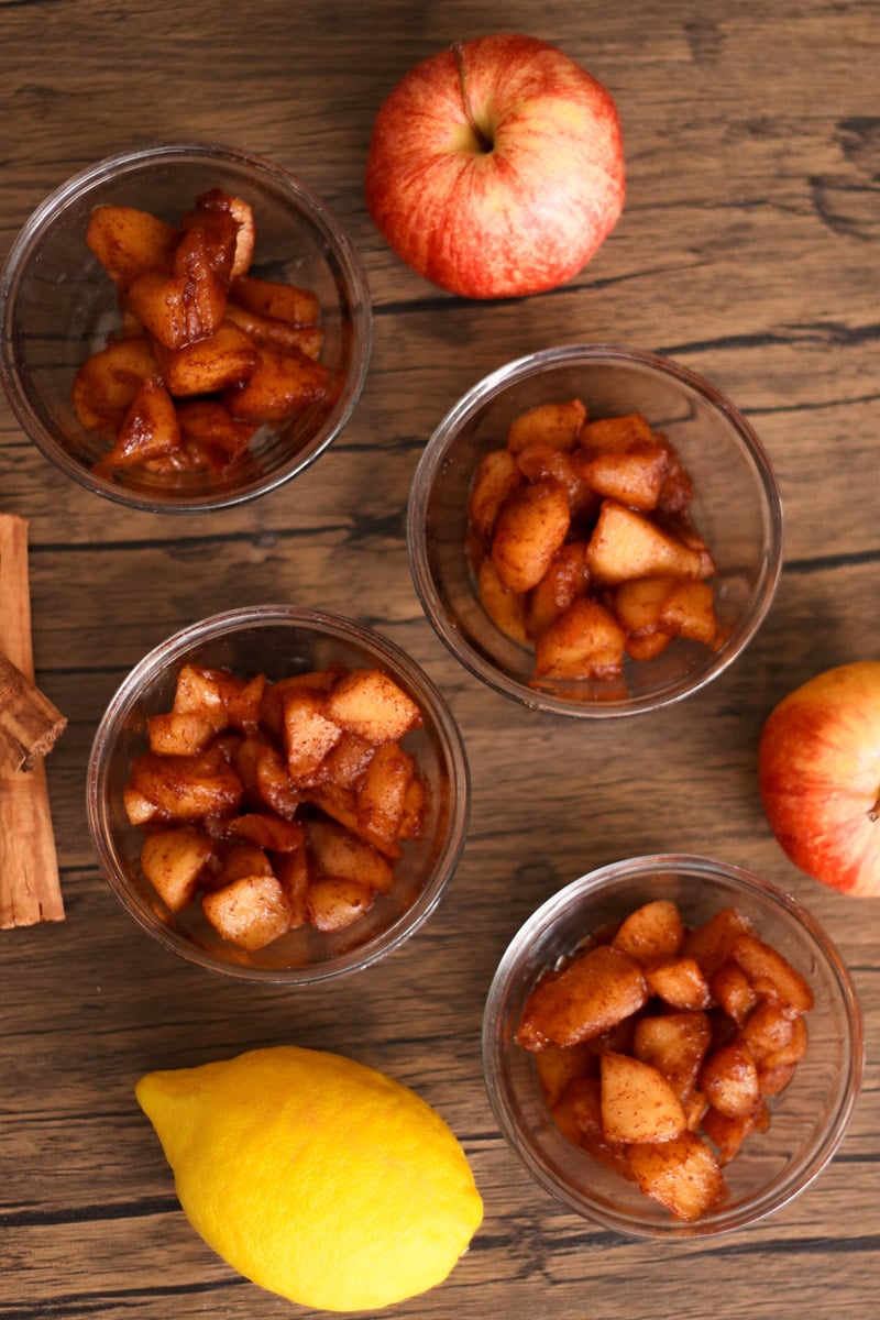 overhead image of apple compote in glass bowls.