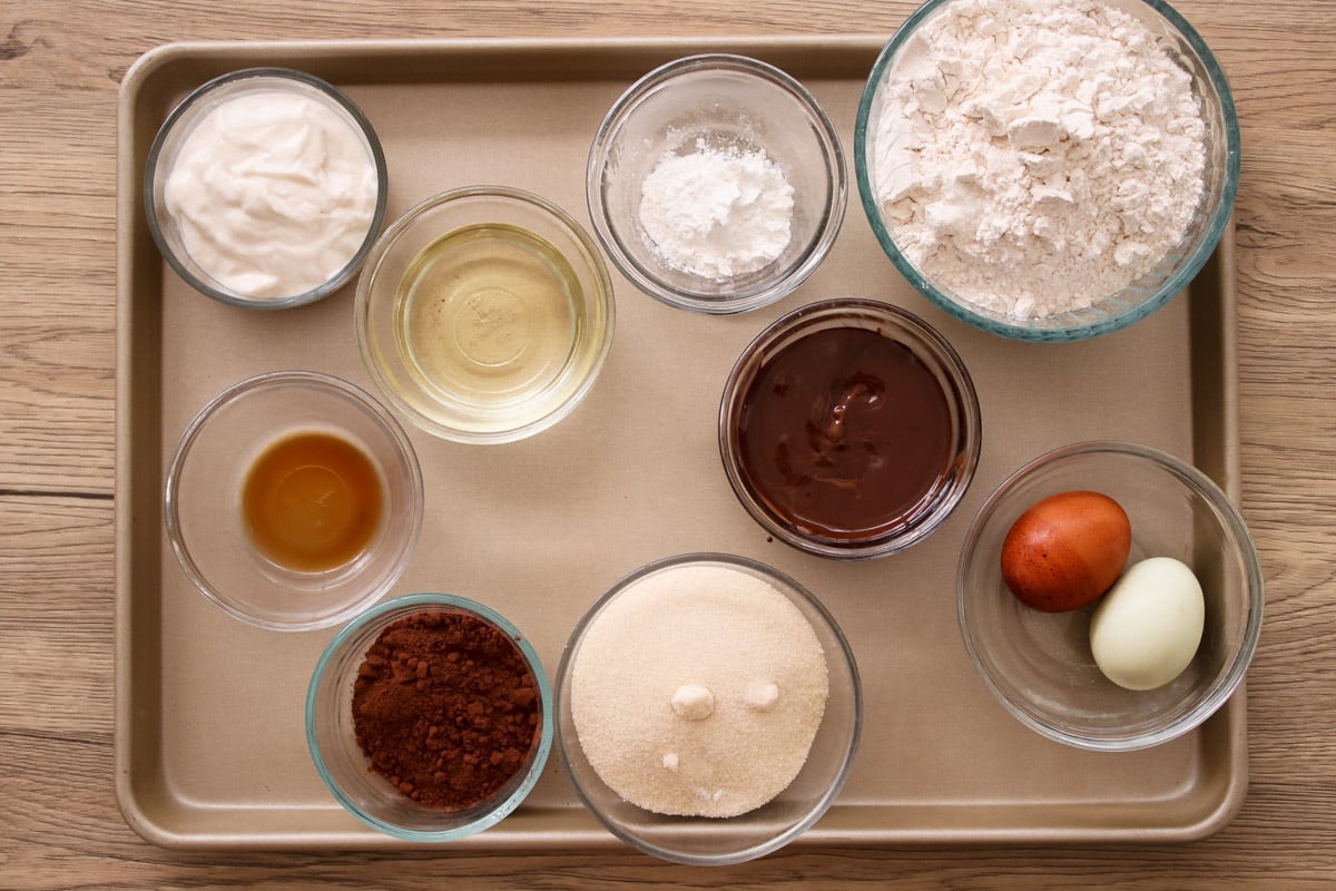 overhead image of ingredients to make an Italian chocolate cake in glass bowls.