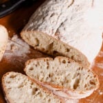 Italian ciabatta bread on cutting board.