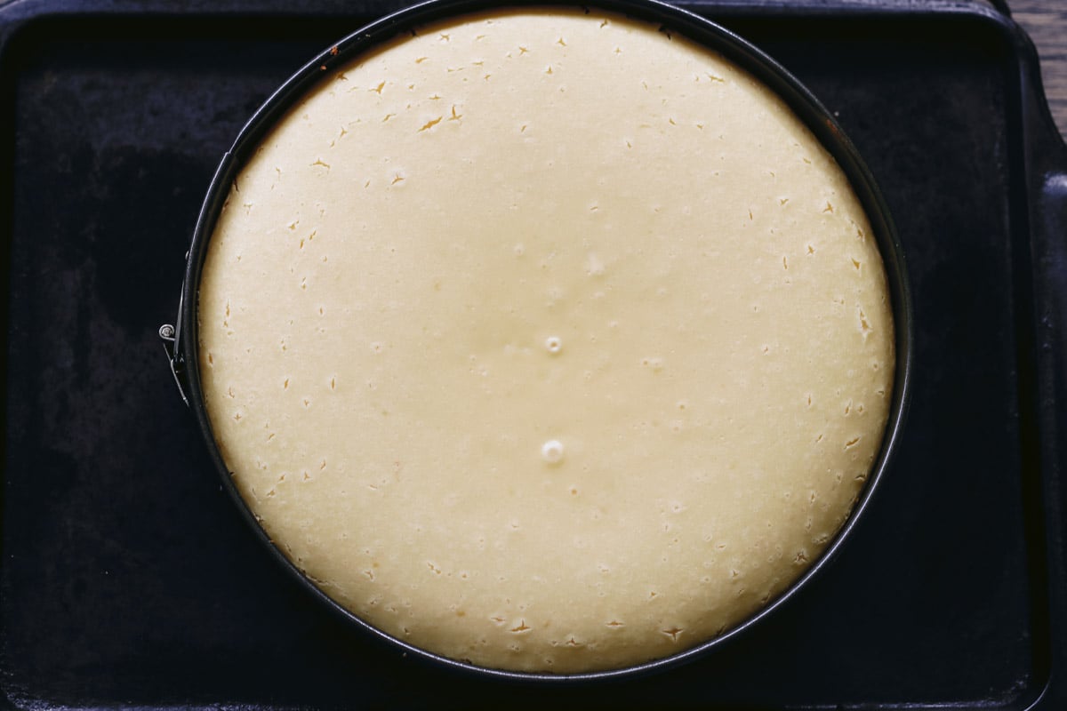 overhead image of cheesecake in a pan.