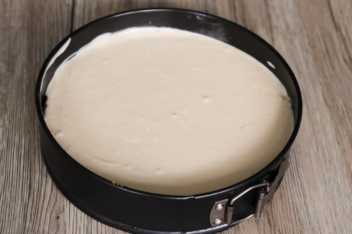 close up image of cheesecake in a pan.