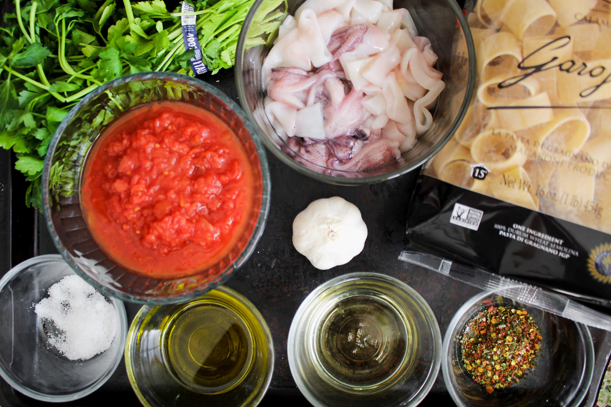 overhead image of ingredients to make calamarata pasta.