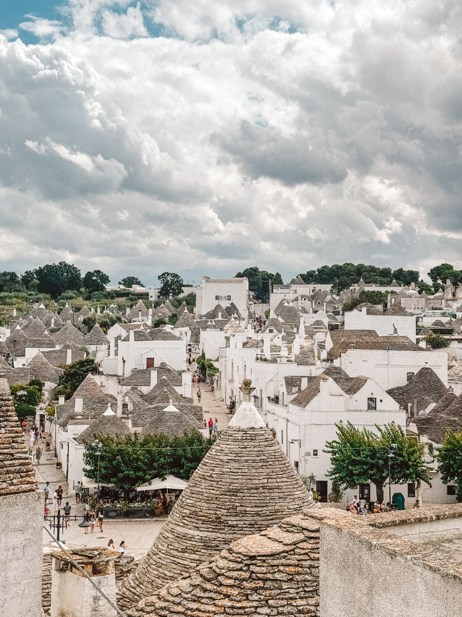 Aerial sunrise view over Alberobello, Puglia, showing hundreds of traditional trulli houses