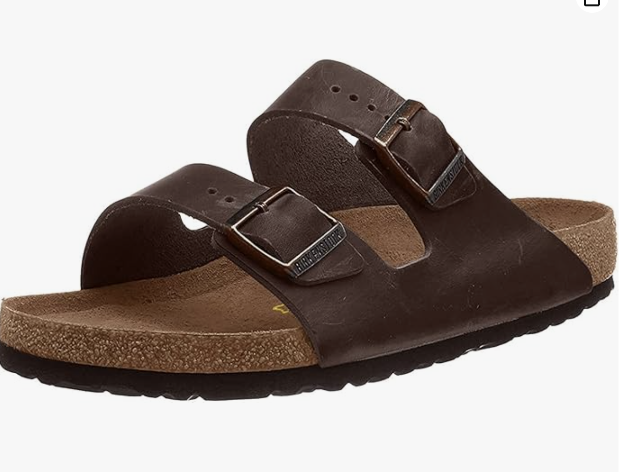 A brown leather Birkenstock sandal with two adjustable buckle straps and a cork footbed, shown on a white background-perfect for those wondering what to wear in Italy for comfort and style.
